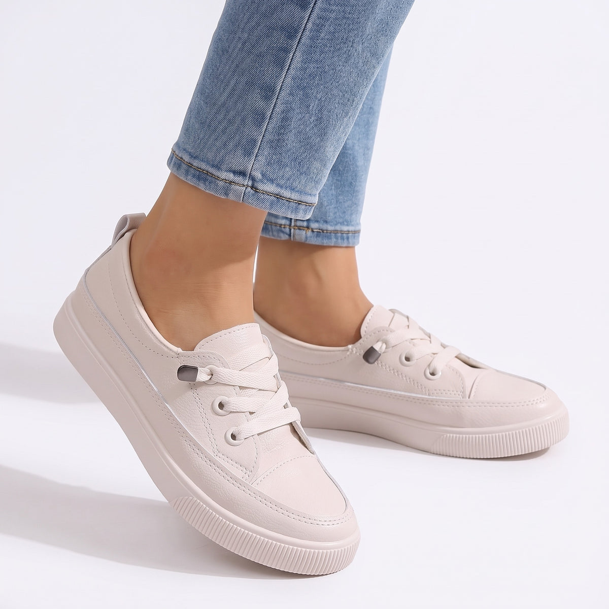 Ursula Women's Cushioned Lace-Up Sneakers worn by model, white studio background