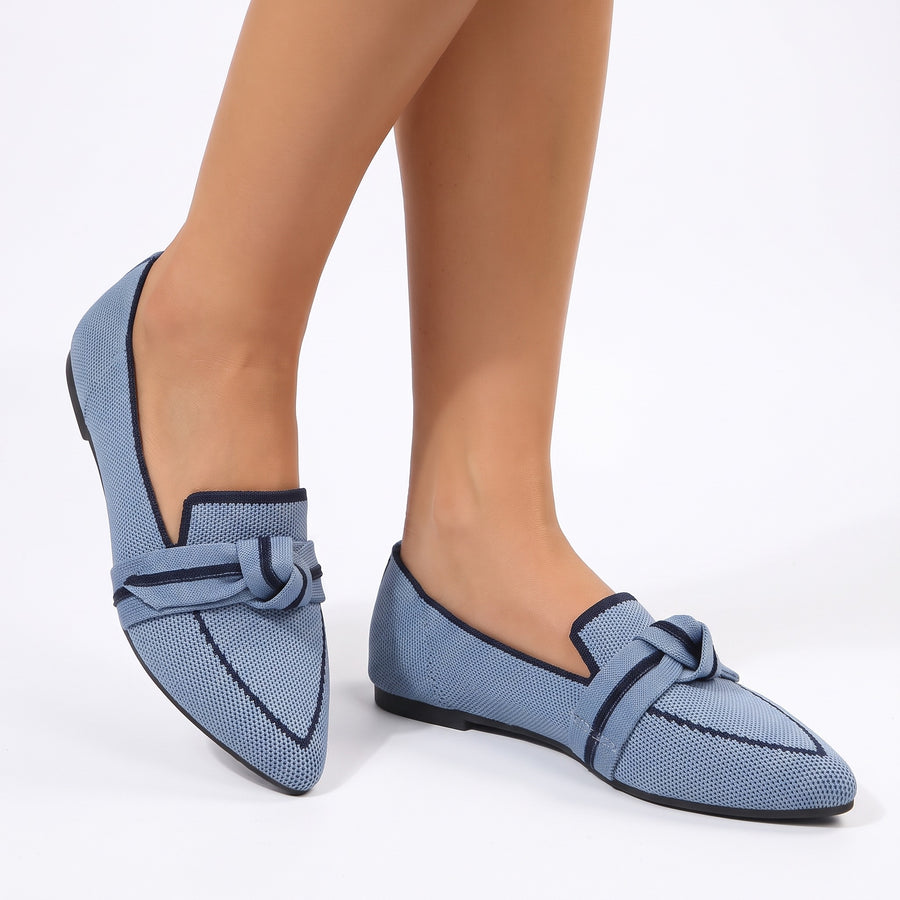 Mavis Women's Penny Loafers worn on feet, powder blue knit mesh with navy trim and knotted bow strap