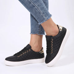 Carmen-Roberta Women's Cushioned Comfort Shoes worn on feet, black quilted sneakers with gold eyelets